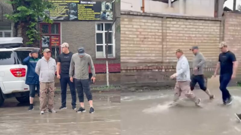 Ош шаарынын мэри жамгырда көчөлөрдү кыдырды