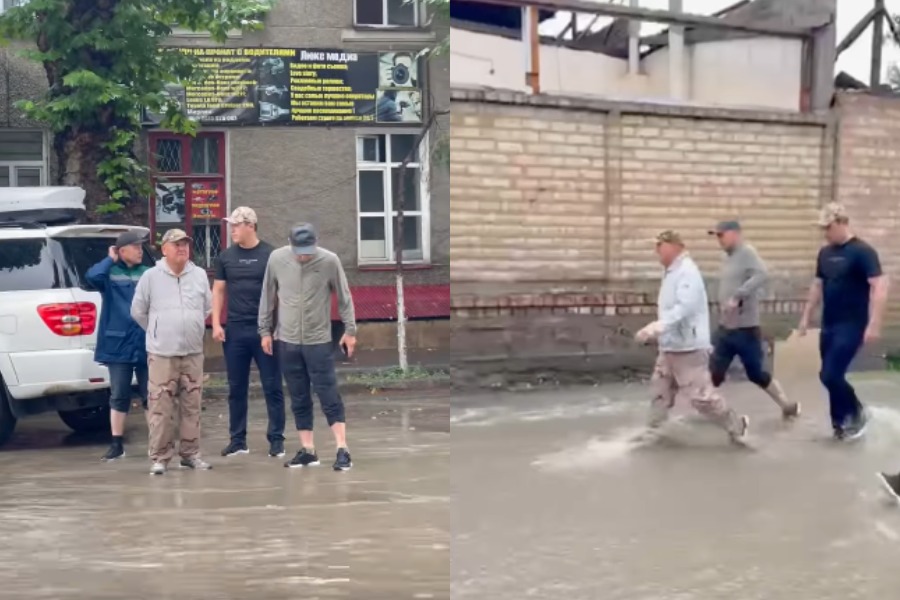 Ош шаарынын мэри жамгырда көчөлөрдү кыдырды